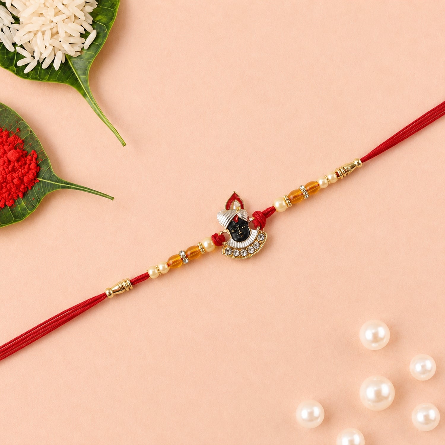 ALVENZA Rakhi – Elegant Pearl Beads & Red Thread for Brothers