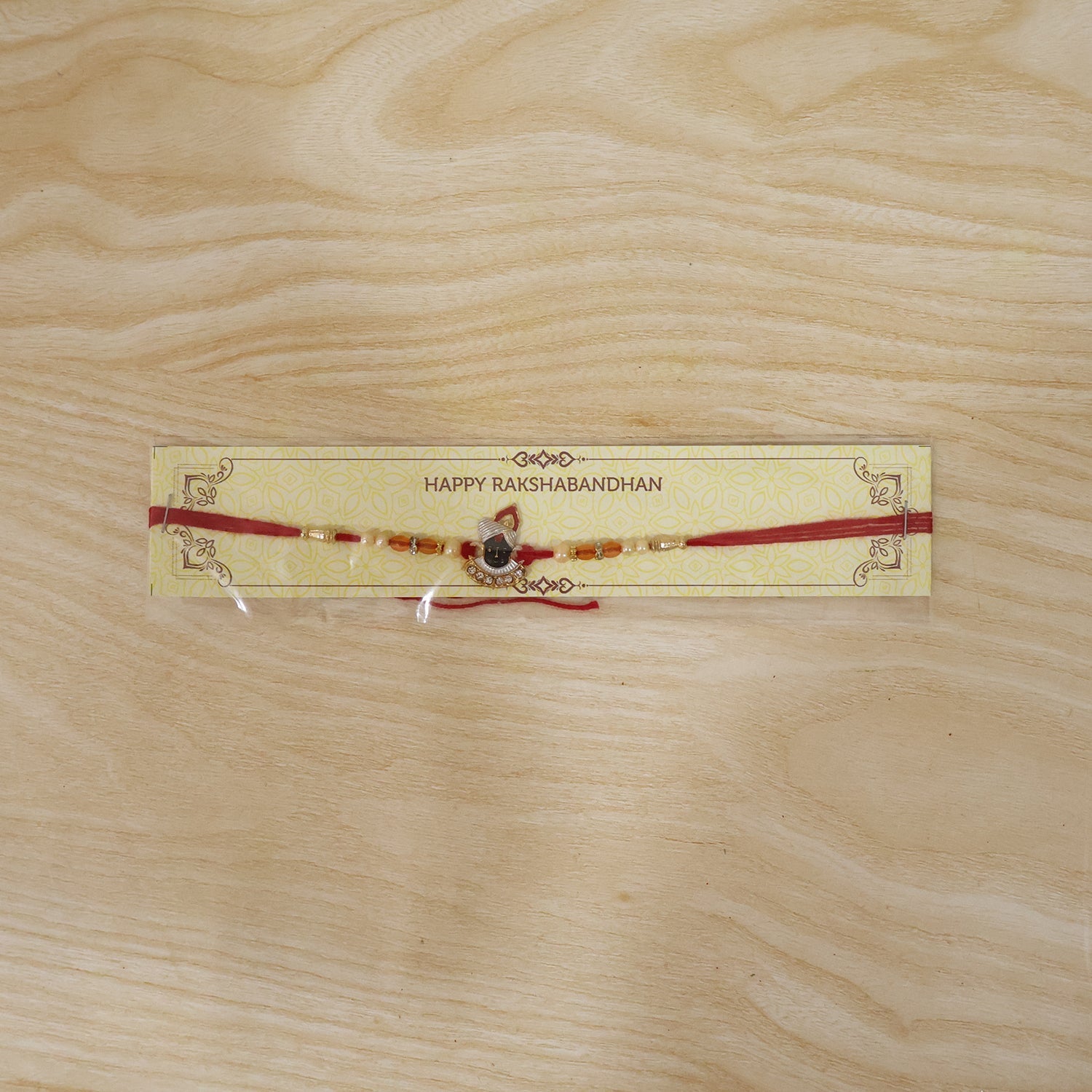 ALVENZA Rakhi – Elegant Pearl Beads & Red Thread for Brothers