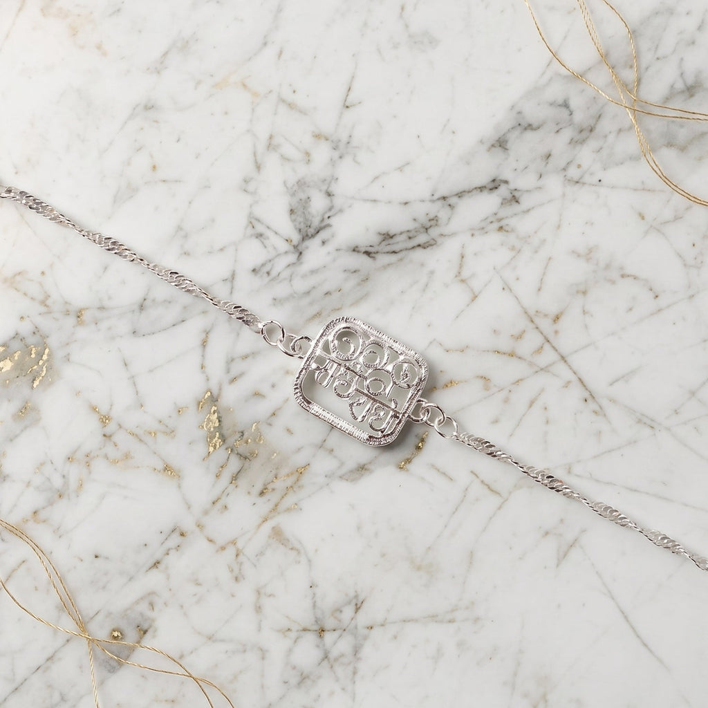 ALVENZA Silver Radhe Radhe Rakhi – Elegant & Spiritual Design for Brothers