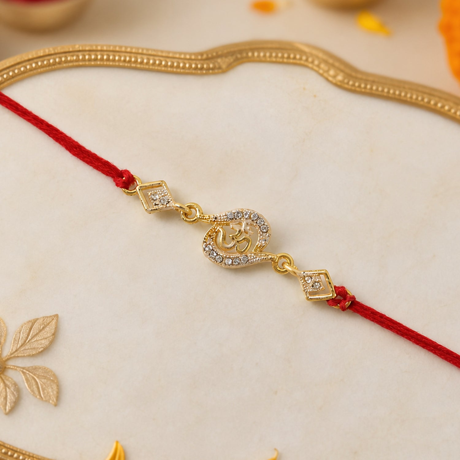 ALVENZA Om Rakhi – Elegant Stone Work & Red Thread for Raksha Bandhan