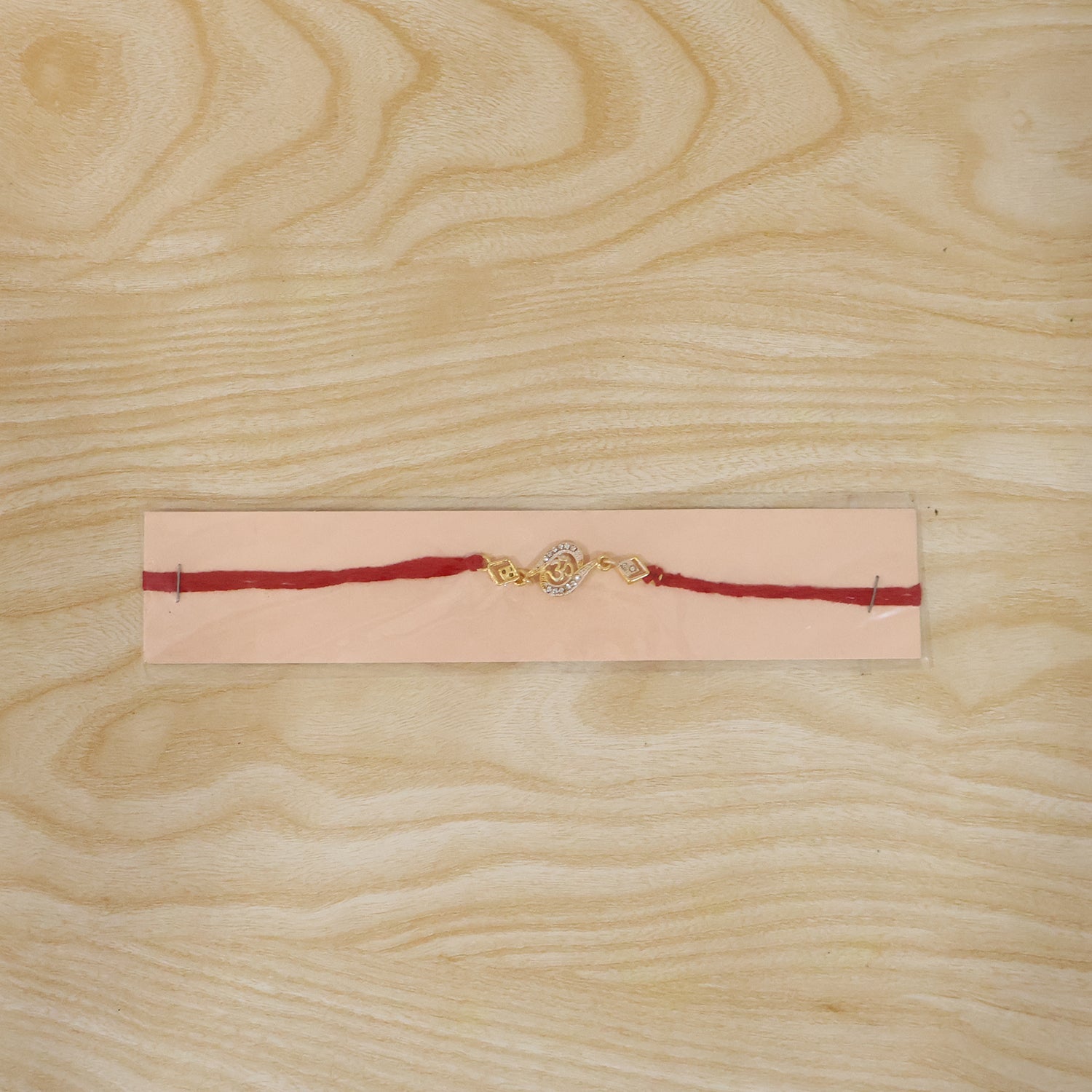 ALVENZA Om Rakhi – Elegant Stone Work & Red Thread for Raksha Bandhan