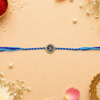 ALVENZA Om Rakhi – Elegant Blue Dori for Brothers on Raksha Bandhan
