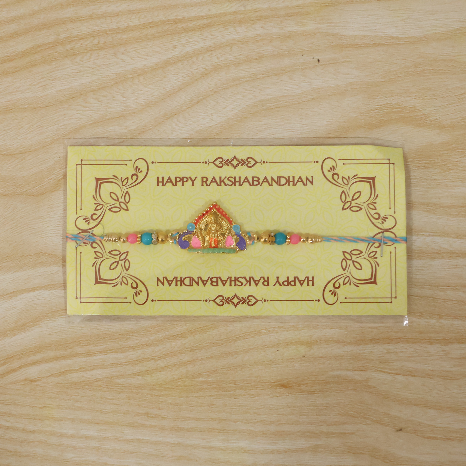 ALVENZA Rakhi – Elegant Divine Idol Charm with Colourful Beads for Rakshabandhan