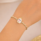 ALVENZA Peach Bottle Charm Rakhi - Elegant Festive Design for Brothers