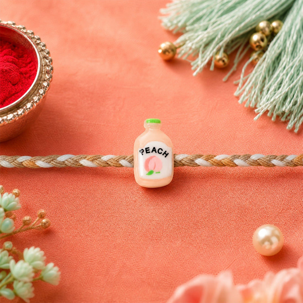 ALVENZA Peach Bottle Charm Rakhi - Elegant Festive Design for Brothers