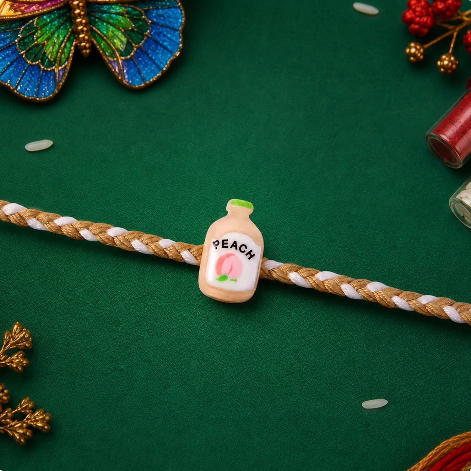 ALVENZA Peach Bottle Charm Rakhi - Elegant Festive Design for Brothers