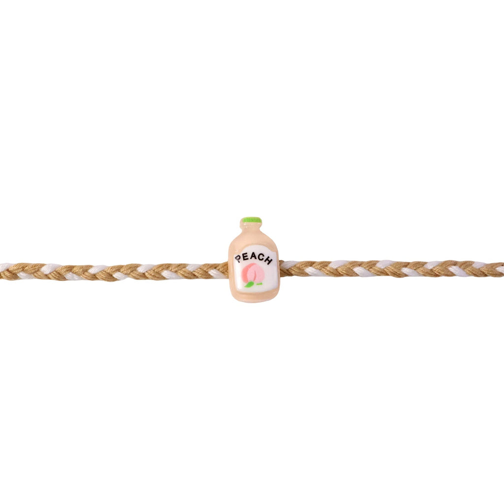 ALVENZA Peach Bottle Charm Rakhi - Elegant Festive Design for Brothers