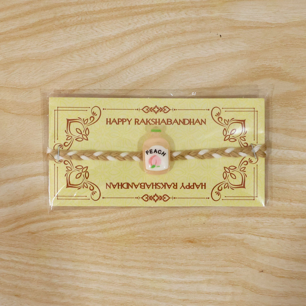 ALVENZA Peach Bottle Charm Rakhi - Elegant Festive Design for Brothers