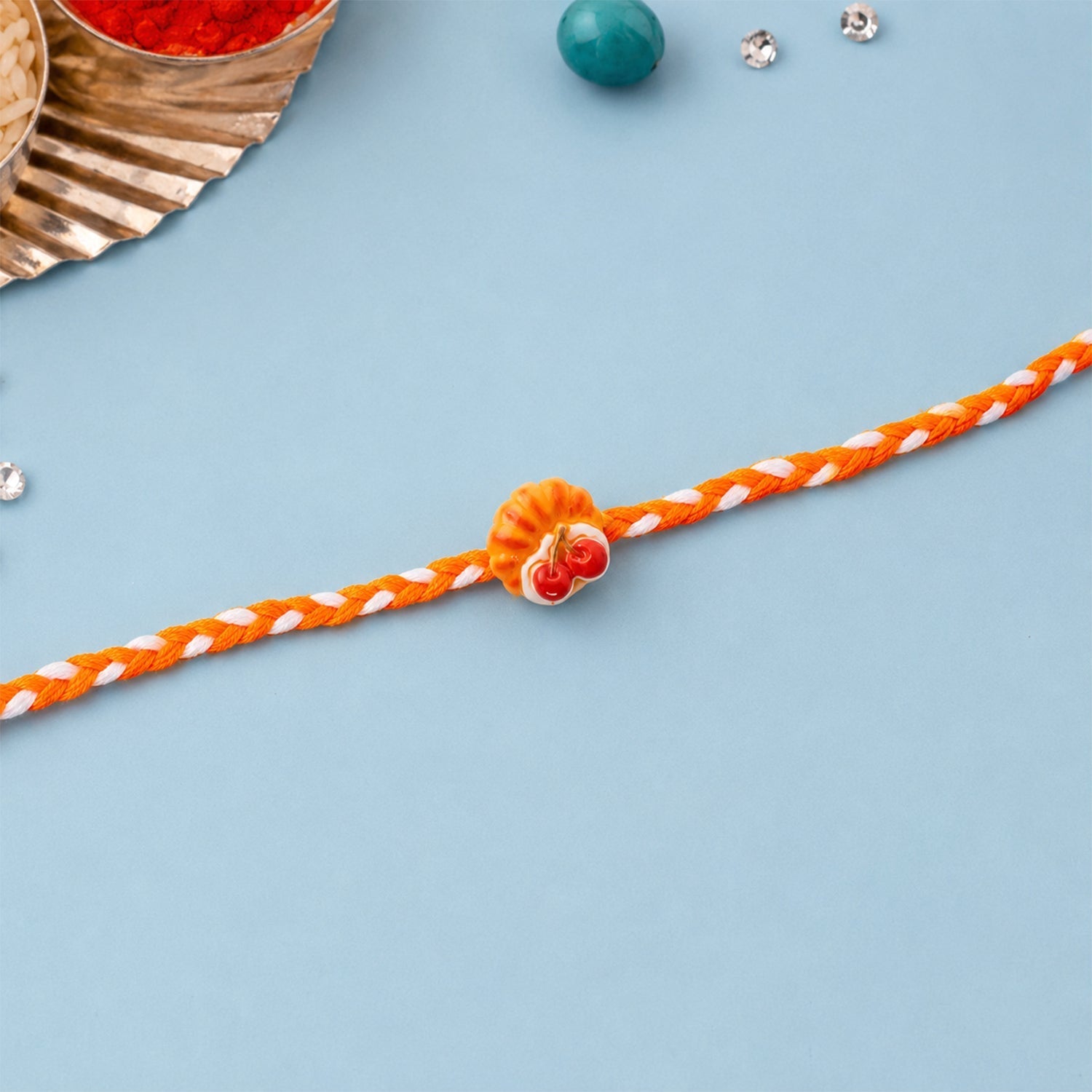 ALVENZA Rakhi for Brother - Unique Cherry Pastry Charm Design