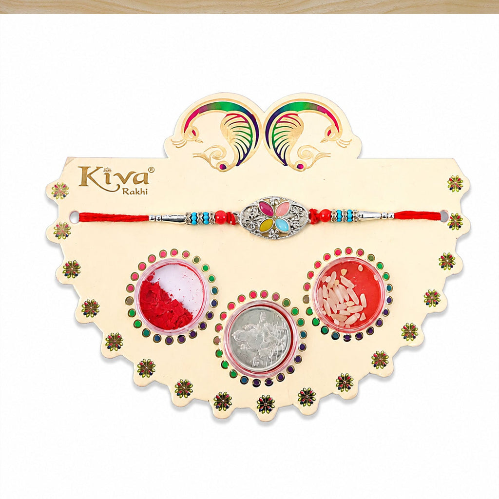 ALVENZA Silver Oval Floral Stone Rakhi with Color Petal Centre, Roli Chawal Coin and Card Packing