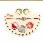 ALVENZA Silver Oval Floral Stone Rakhi with Color Petal Centre, Roli Chawal Coin and Card Packing