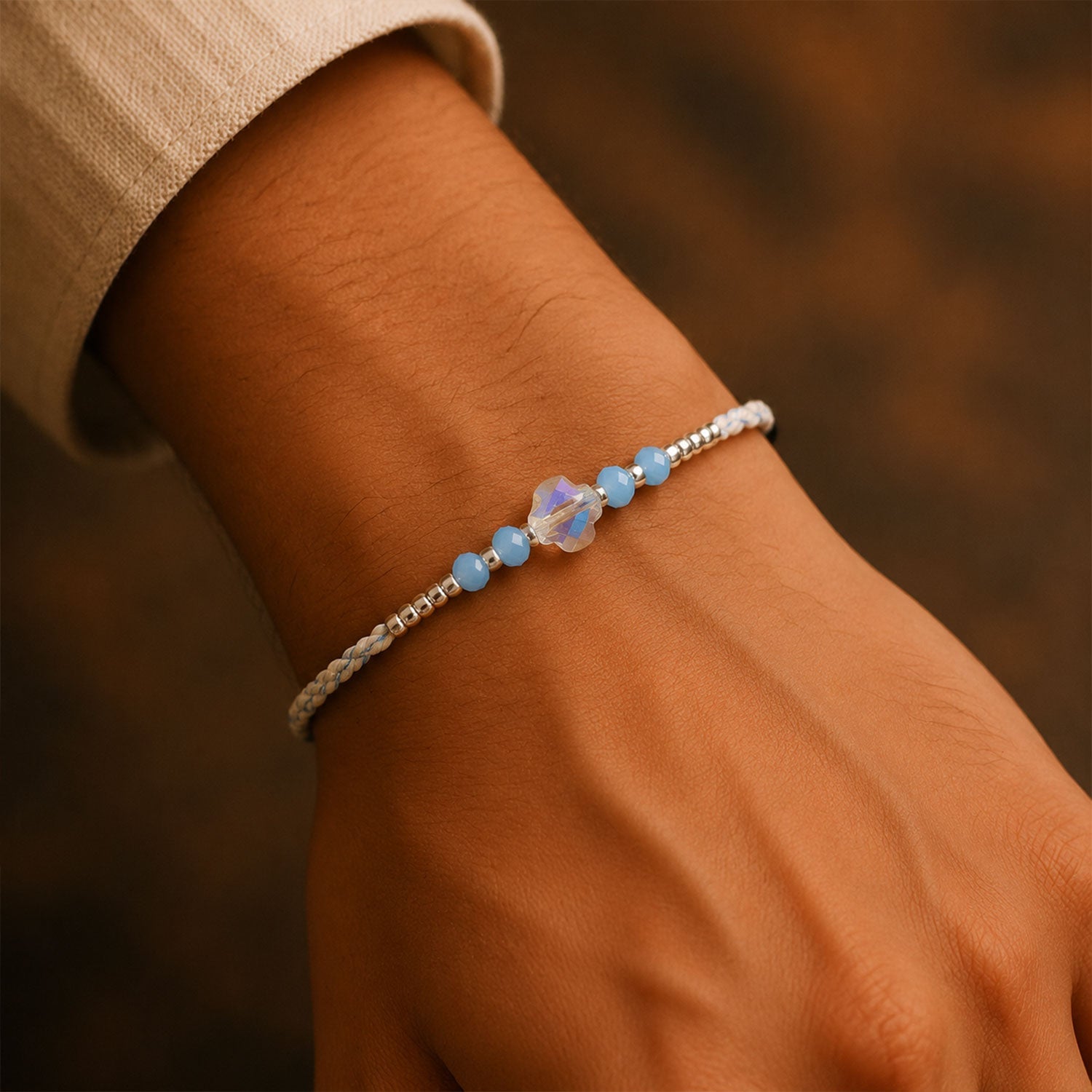 ALVENZA Blue Crystal Bead Rakhi with Round Stone Centre, Silver Highlights and Red Thread