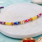 ALVENZA Rainbow Beaded Charm Rakhi with Colorful Festive Style and Playful Bracelet Look